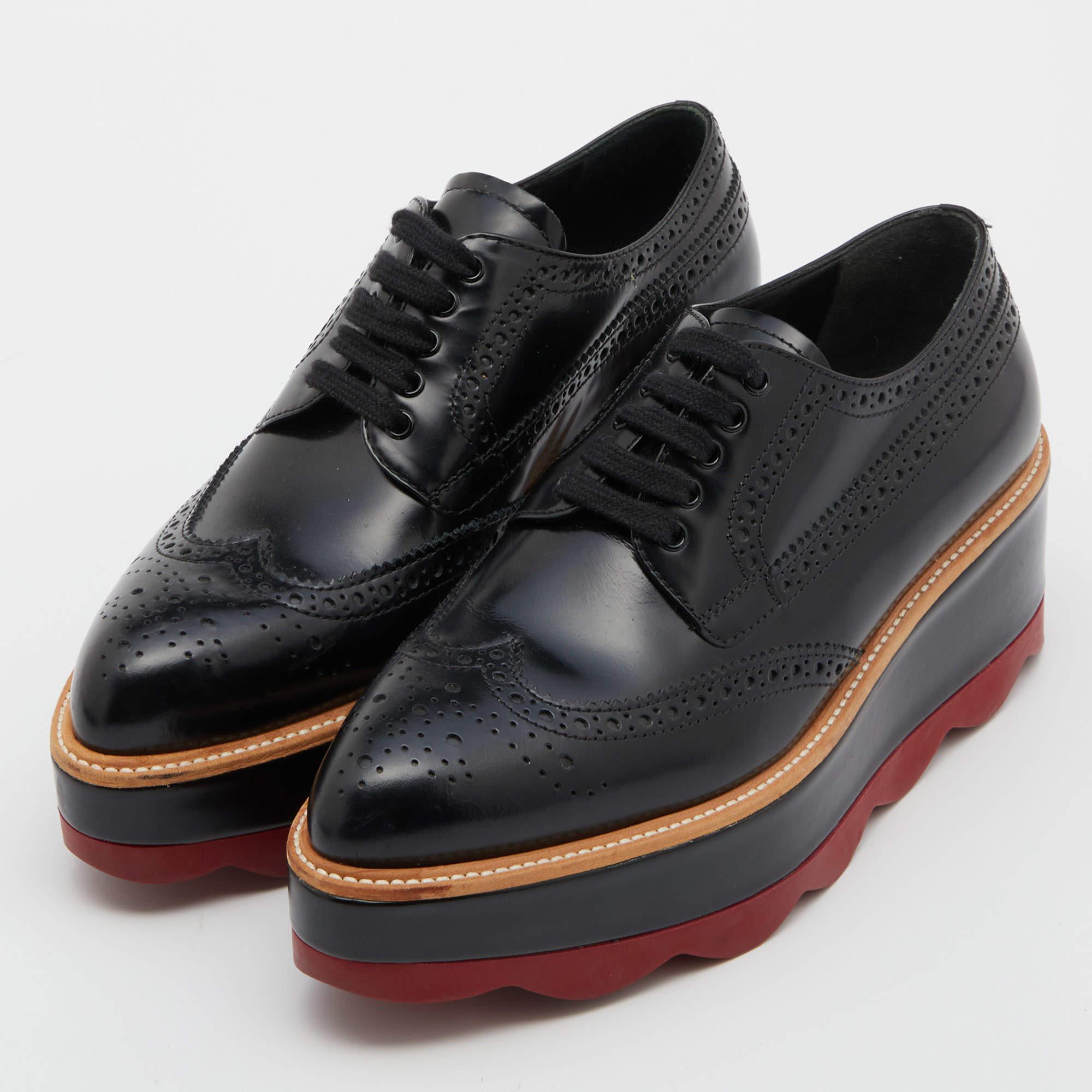 How can one not be in awe by just looking at this luxe pair from Prada! The brogue leather Derbies are well-crafted and they are beautified with lace-ups and wingtip detailing. Comfortable insoles and chunky platforms complete this must-have pair!


