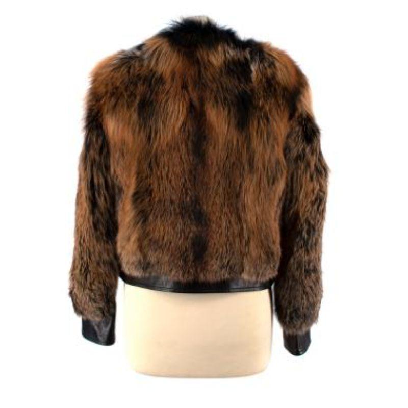 Prada Leather & Fox Fur Jacket
 

 - Black leather bomber jacket with dyed fox fur 
 - Partially leather sleeves and body
 - Orangey brown and black dyed fox fur 
 - Silver zip down the front 
 - Round neck with no collar 
 - Quilted satin lining 
