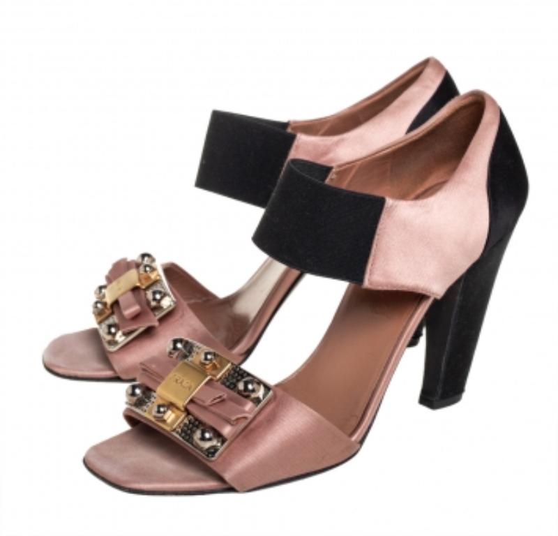 These sandals from Prada are embellished which gives them an opulent touch making the pair look both feminine and glamorous. Crafted from satin and fabric, the sandals come in brown and brown hues. The heels and comfortable insoles complete the