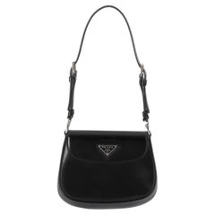 Mini Cleo in pelle spazzolata nera di Prada