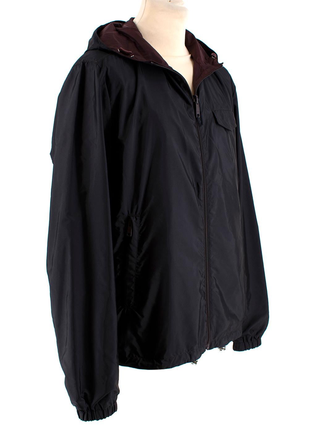 Prada Black & Burgundy Reversible Hooded Nylon Jacket 

- Made of the signature nylon 
- Branded Prada Luna Rossa Patch to the black side 
- Pockets to the front 
- Classic cut 
- Zip fastening to the front 
- Practical versatile design