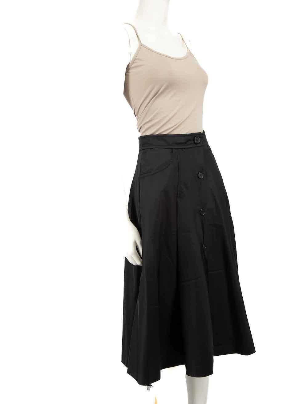 CONDITION is Very good. Hardly any visible wear to skirt is evident on this used Prada designer resale item.
 
 
 
 Details
 
 
 Black
 
 Synthetic
 
 Skirt
 
 A-Line
 
 Midi
 
 Front buttoned fastening
 
 2x Side pockets
 
 
 
 
 
 Made in Romania
