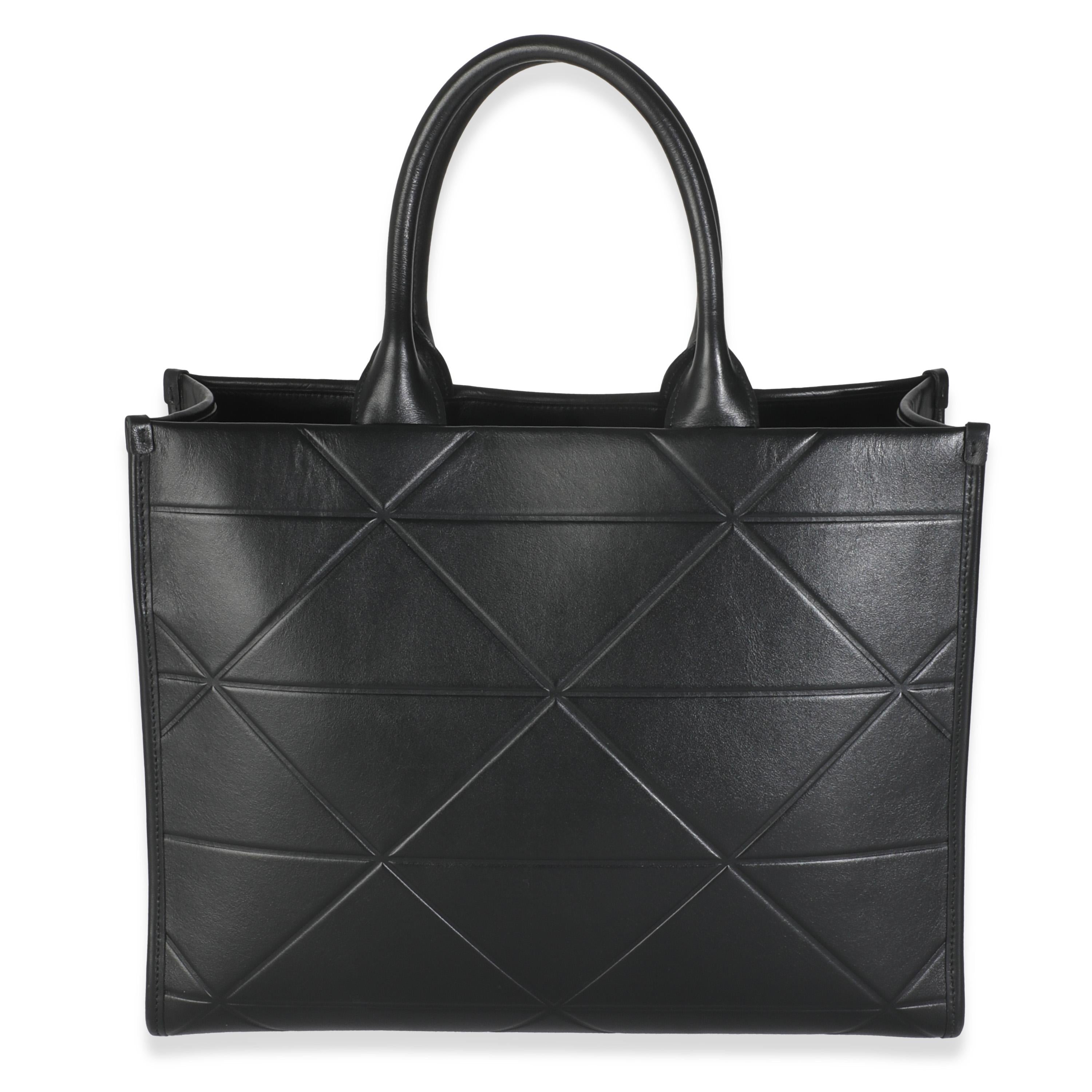 Listing Title: Prada Black Calfskin Medium Symbole Tote
SKU: 145407
MSRP: 3250.00 USD
Condition: Pre-owned 
Handbag Condition: Excellent
Condition Comments: Item is in excellent condition and displays light signs of wear.   Minor corner scuffing and