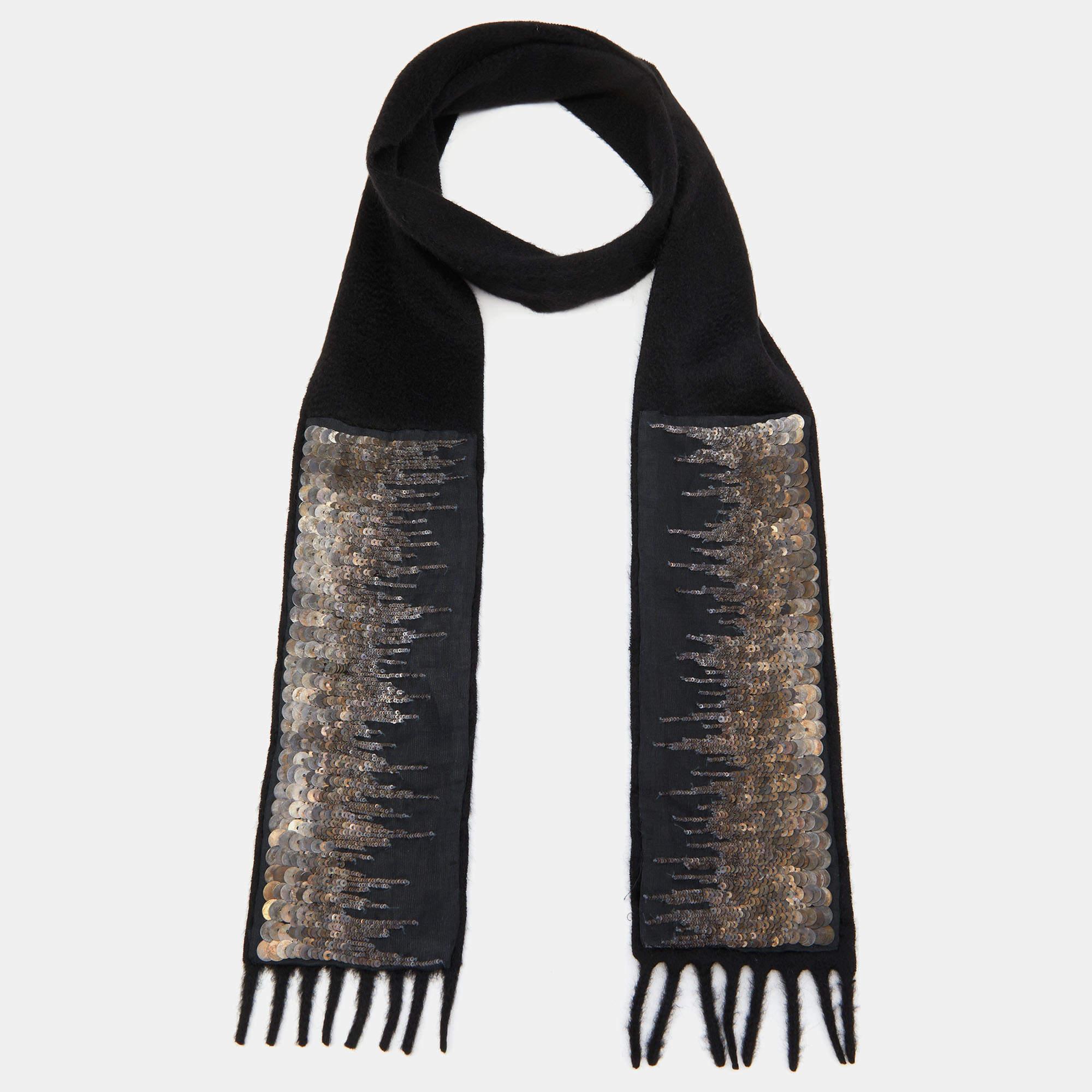 Prada designed this scarf with intricate details on cashmere. It has sequin embellishments and fringe edges. Style it around your neck.

Includes: Price Tag
