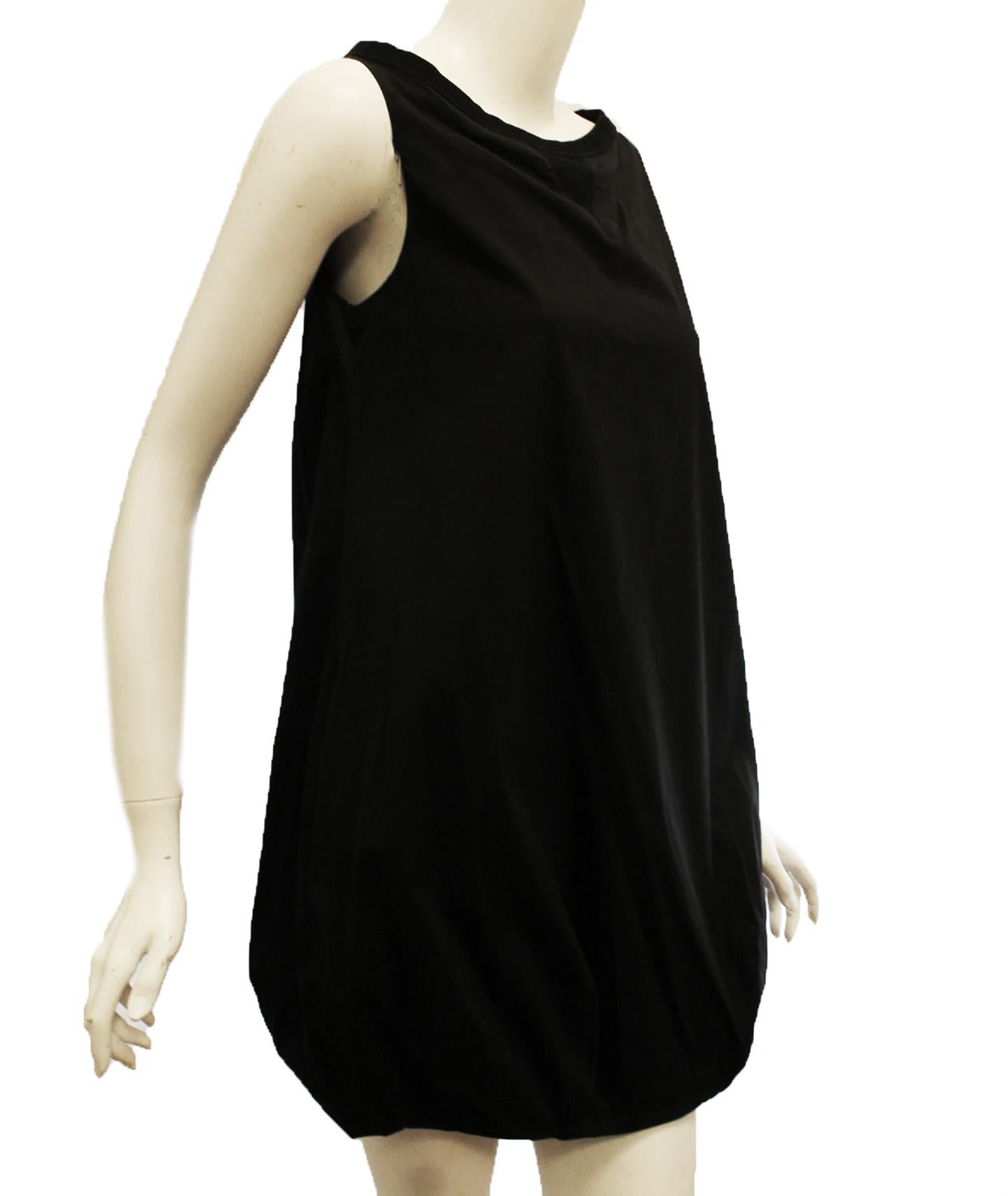 Prada black loose fitting cotton blend sleeveless dress is effortless and alluring in equal measure. This dress incorporates a ribbed knit bateau neckline with triangle accent at chest.   This loose fitting dress is gathered at the hem for that