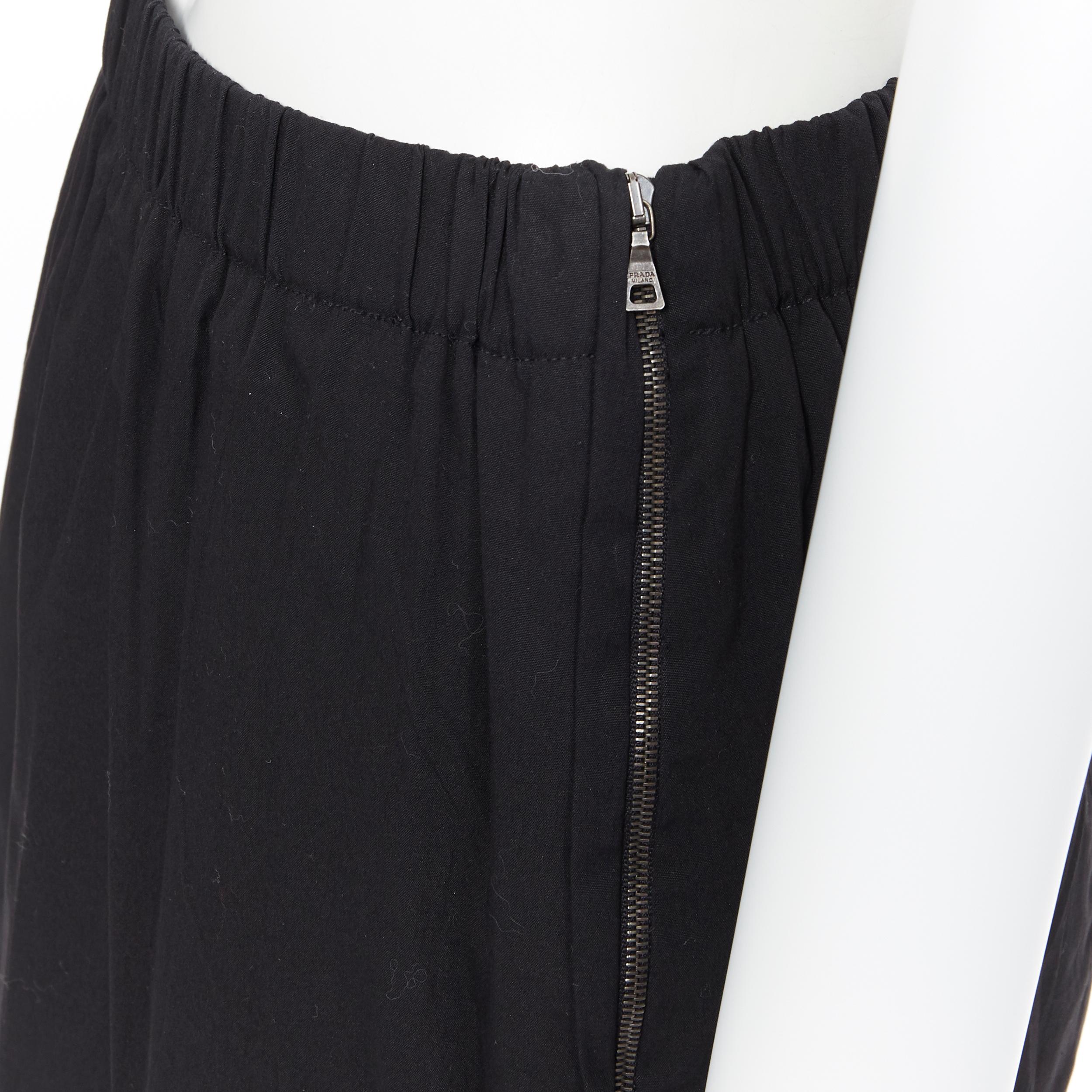 PRADA black cotton blend elasticated waist center vent casual skirt IT42
Brand: Prada
Designer: Miuccia Prada
Model Name / Style: Cotton skirt
Material: Cotton blend
Color: Black
Pattern: Solid
Extra Detail: Mid rise.
Made in: Italy

CONDITION: