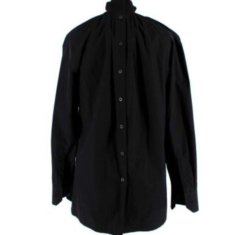 Prada Black Cotton High Neck Shirt with Button Back Detail

- High neck cotton shirt with a relaxed fit
- Button down detail at the back
- Ruched high neck with pleats down the front and back
- Long sleeves with buttoned shirt cuffs
- Slightly