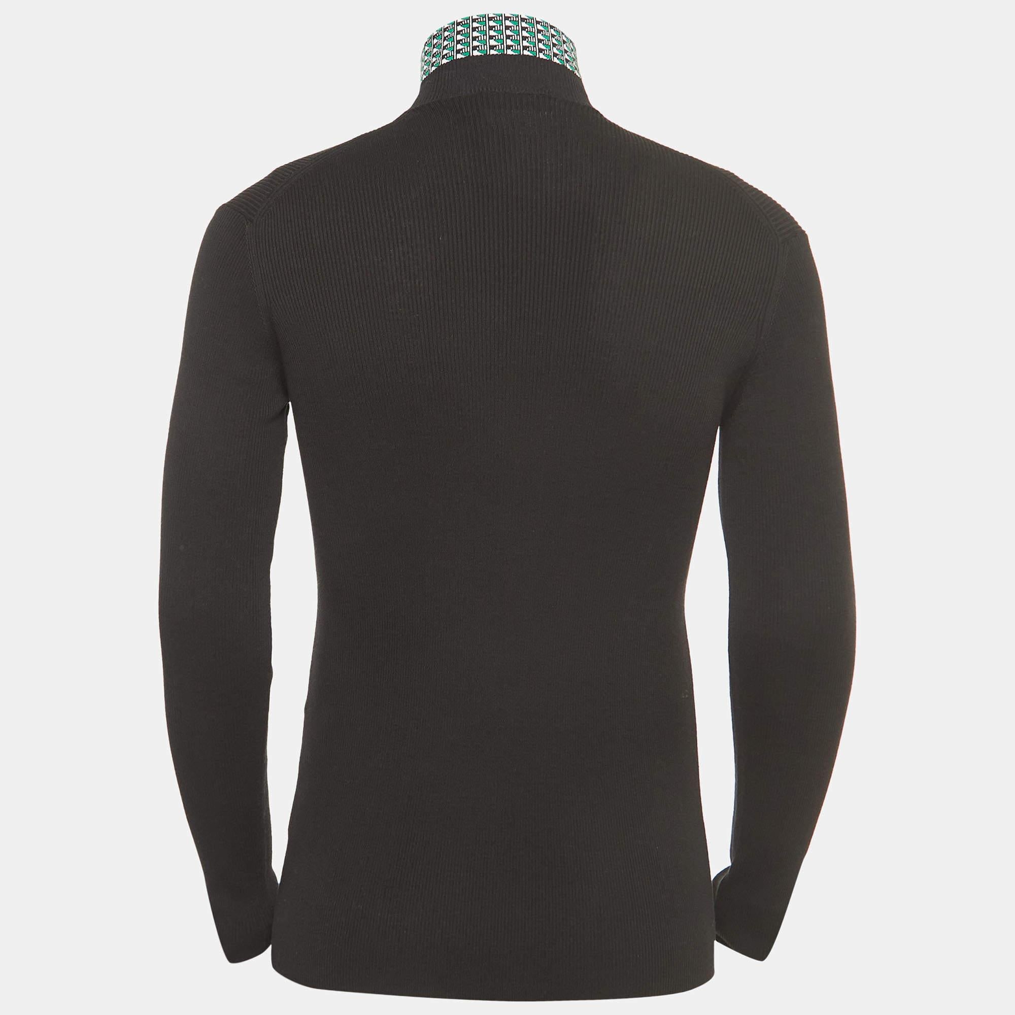 The Prada sweater is a luxurious and versatile wardrobe staple. Crafted from high-quality cotton, it features a sophisticated jacquard pattern and a cozy turtleneck. This timeless piece seamlessly blends comfort with elevated style, making it a
