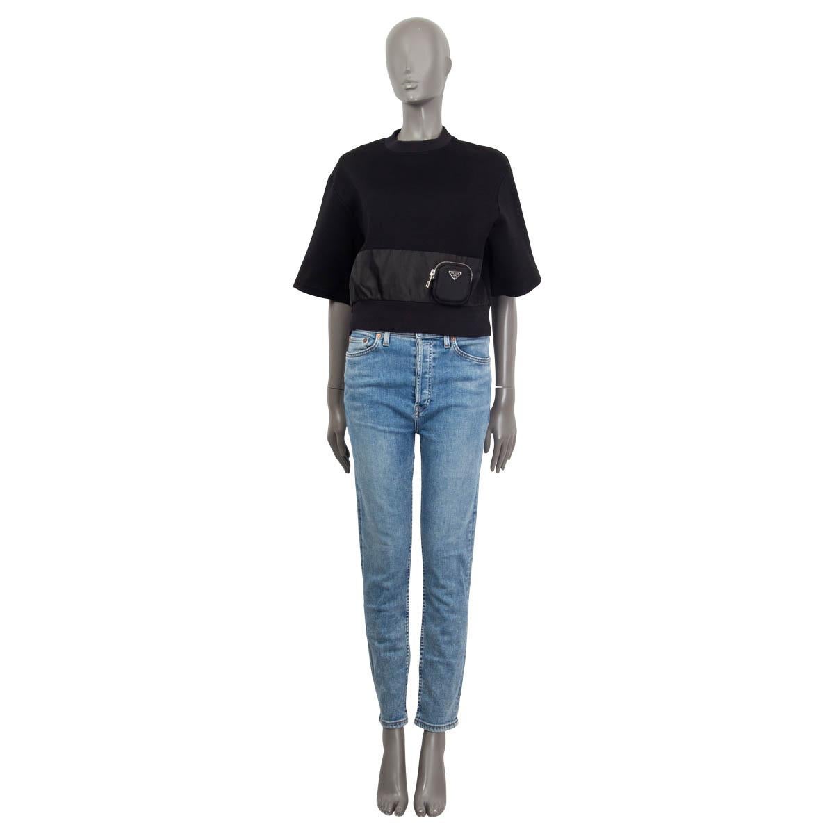 100% authentic Prada oversized cotton fleece t-shirt in black cotton (62%) and polyamide (38%). Features wide short sleeves and a distinctive band on the front in nylon. Has a detachable small pouch on the front. Has been worn once and is in