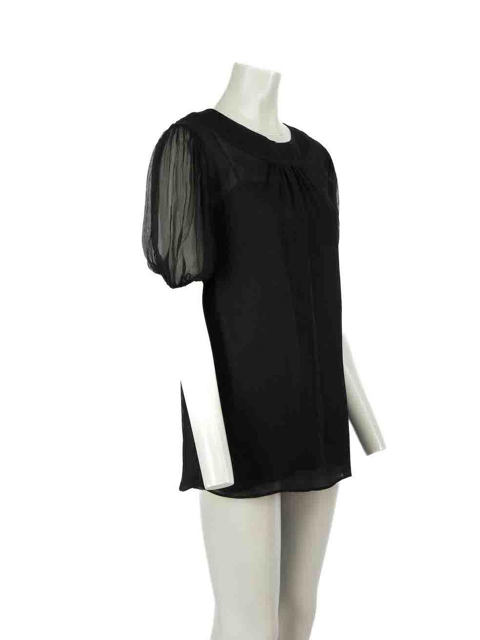 CONDITION is Very good. Minimal wear to blouse is evident. Minimal wear to the right sleeve with sticky residue and there is a small hole at the rear on this used Prada designer resale item. The composition label has been removed.
 
 Details
 Black
