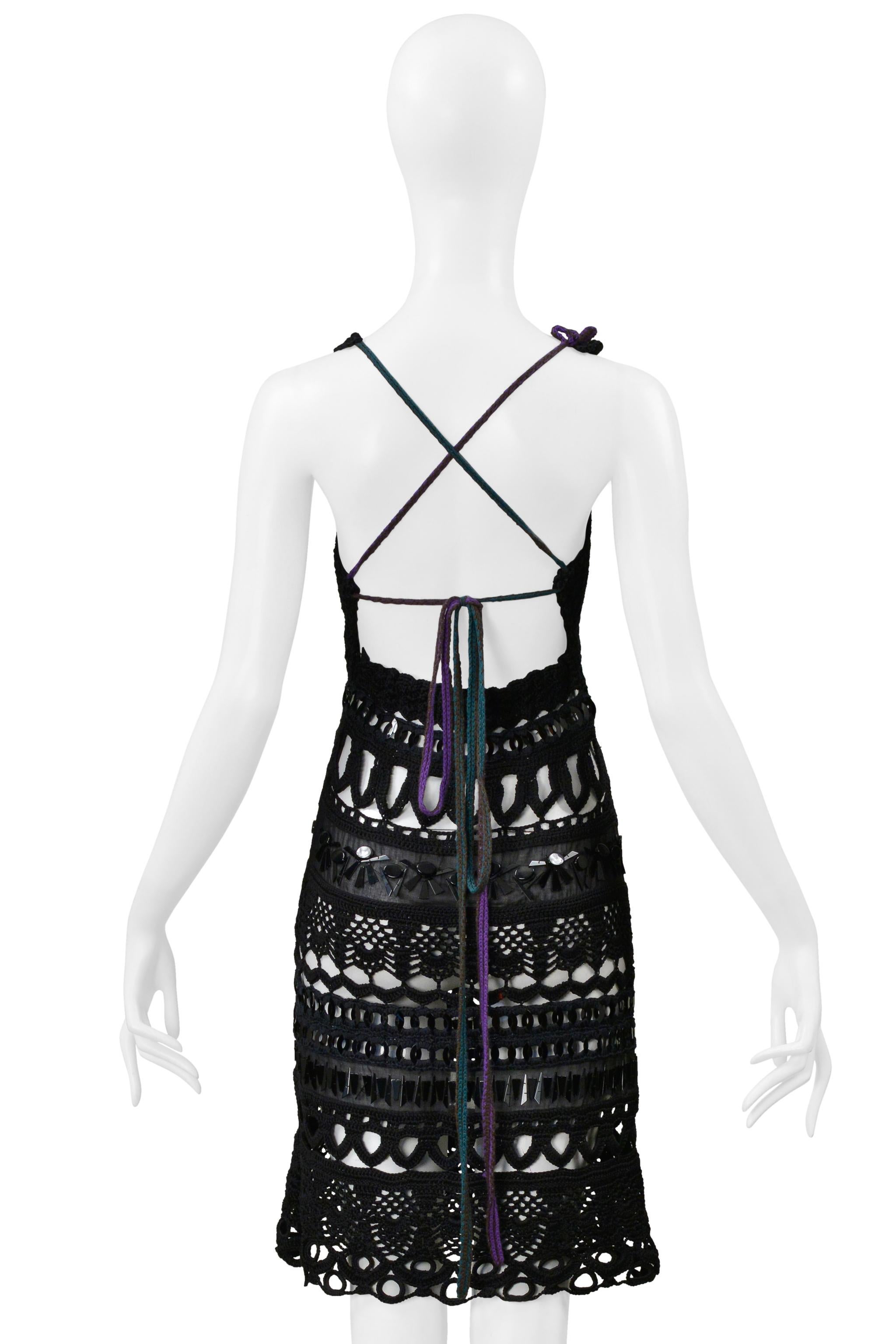 Resurrection Vintage is thrilled to offer a vintage Prada crochet dress featuring knit purple and green halter straps, geometric paillettes, unlined, hidden zip closure, and above the knee length, and an open back. 

Prada

2005 Collection
Size: