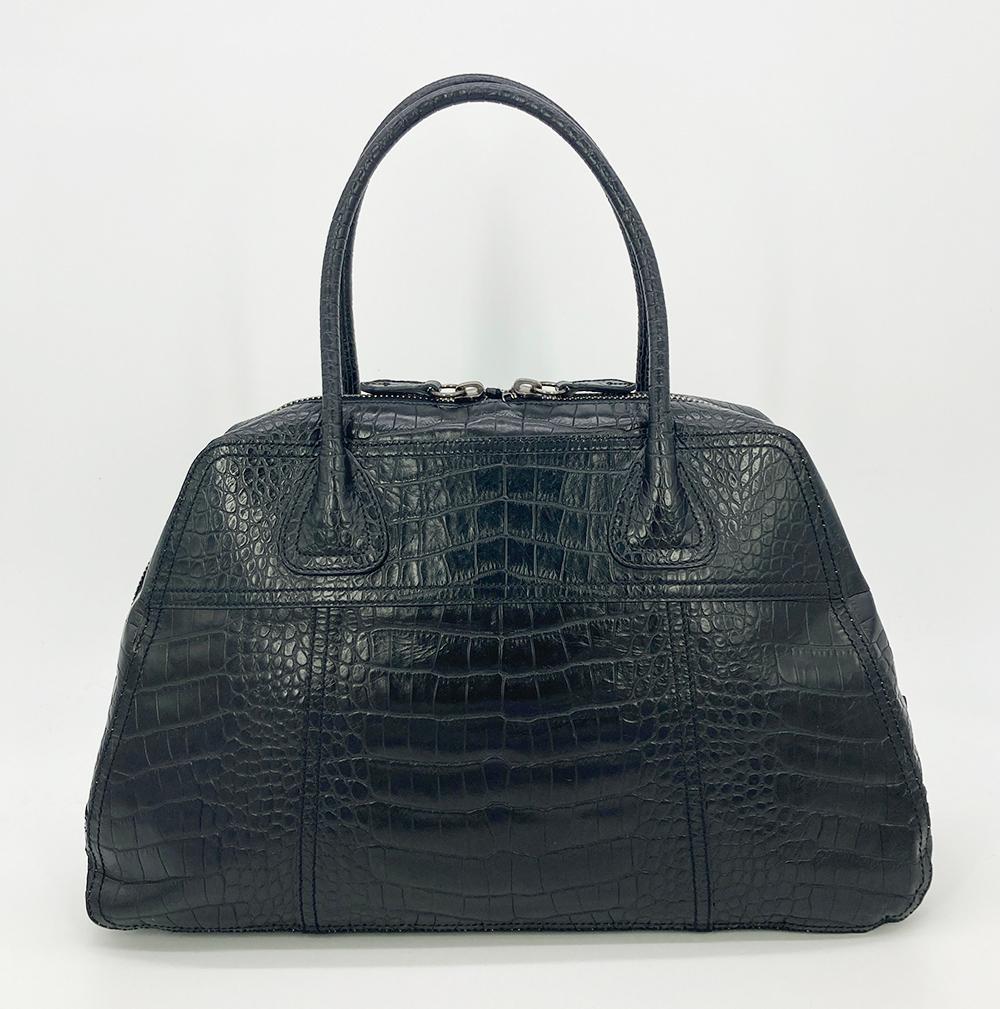 Prada Black Crocodile Top Handle Tote in excellent condition. Black crocodile exterior trimmed with double top handles and silver hardware. Double top zip closure opens to a black nylon interior withe one side zipped pocket. Excellent condition. No