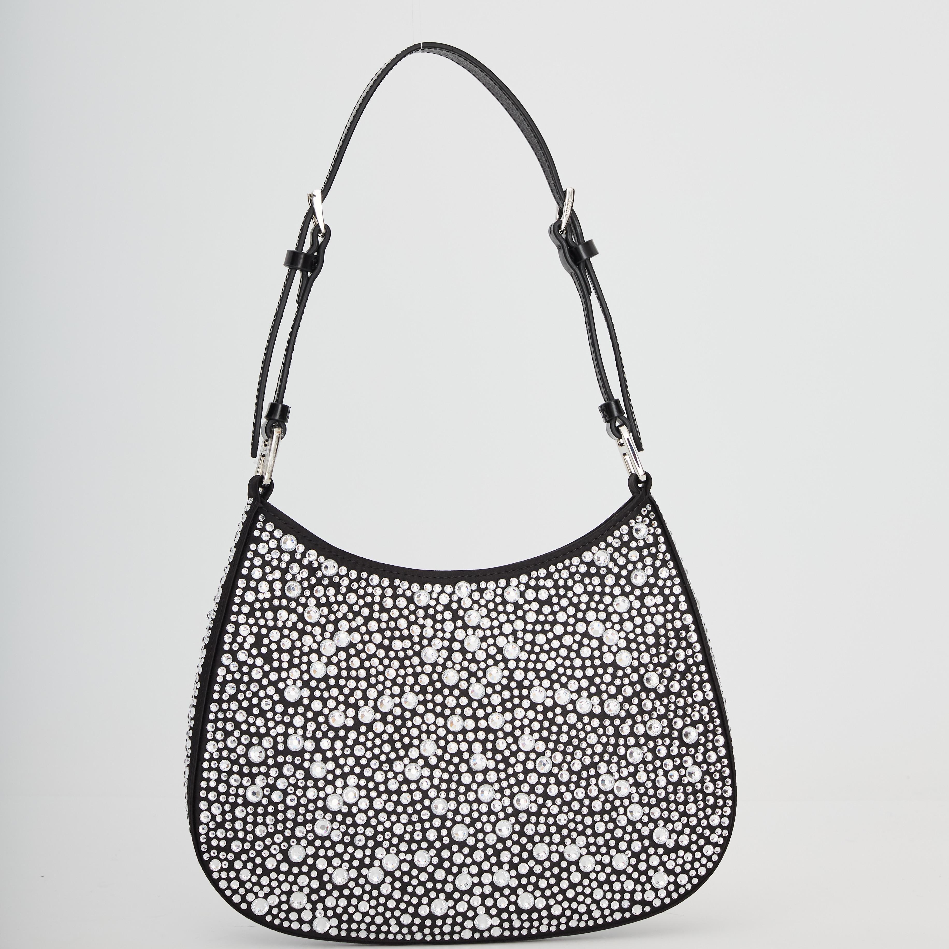 Satin shoulder bag in black featuring crystal-cut appliqués throughout.  Adjustable shoulder strap at top. Logo plaque at face. Press-stud closure at main compartment. Patch pocket at interior. · H 7.5 x W9 x D1 in

COLOR: black with sliver