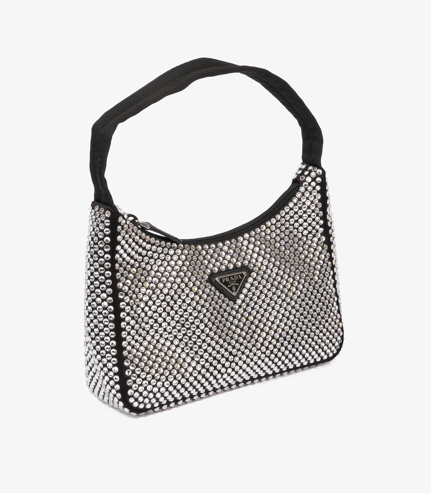 Prada Black Crystalised Satin Re-Edition 2000 Mini Bag

Product Details
Xupes Ref: CB1349
Brand: Prada
Model: Re-Edition 2000 Mini Bag
Type: Top Handle, Shoulder
Serial Number: 31
RRP: £1,660
Accompanied By: Prada Dust Bag
Colour: Black 
Hardware: