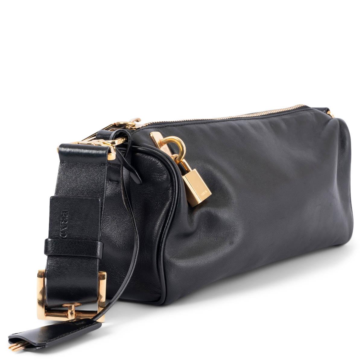 100% authentic Prada boxy shoulder bag in black smooth lambskin featuring gold-tone hardware. Open with a top zip to a logo nylon lined interior with a zipper pocket against the back. Has been carried and is in excellent condition. Comes with lock,