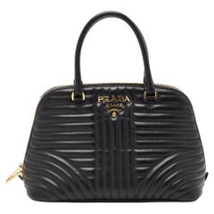 Prada - Sac à main Promenade en cuir matelassé avec monogramme noir