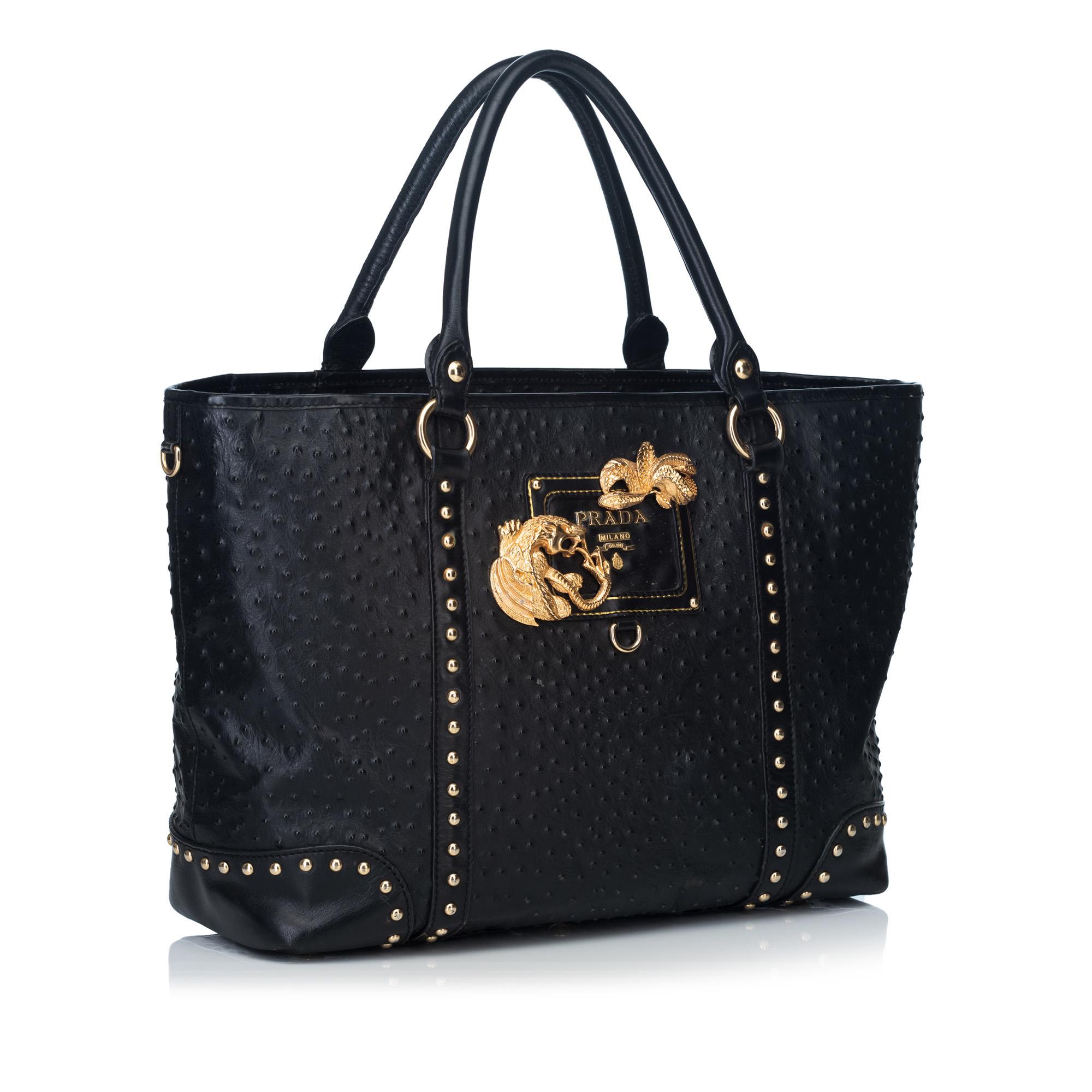 This tote features a textured leather body, rolled leather handles, top zip closure, interior slip pockets, and an interior zip pocket. It carries as AB condition rating.

Inclusions: 
This item does not come with inclusions.

Dimensions:
Length: