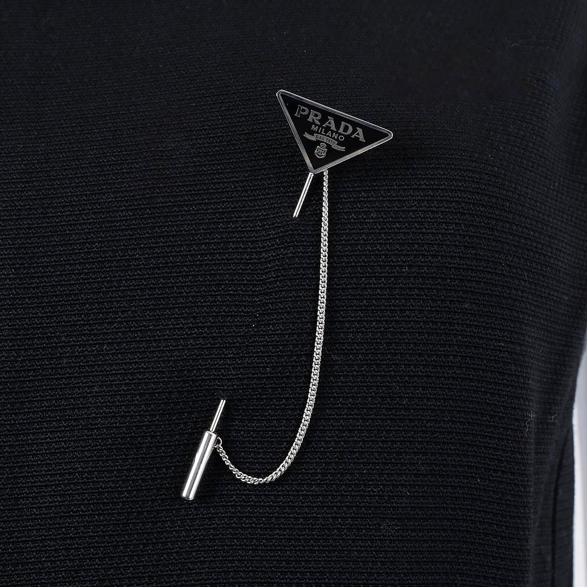 100% authentic Prada brooch in sterling silver with triangle logo in black enamel. Has been worn and is in virtually new condition. Comes with dust bag and box.

Measurements
Model	2JS113_2DSP_F0002_TU
Width	2cm (0.8in)
Length	8cm (3.1in)

All our