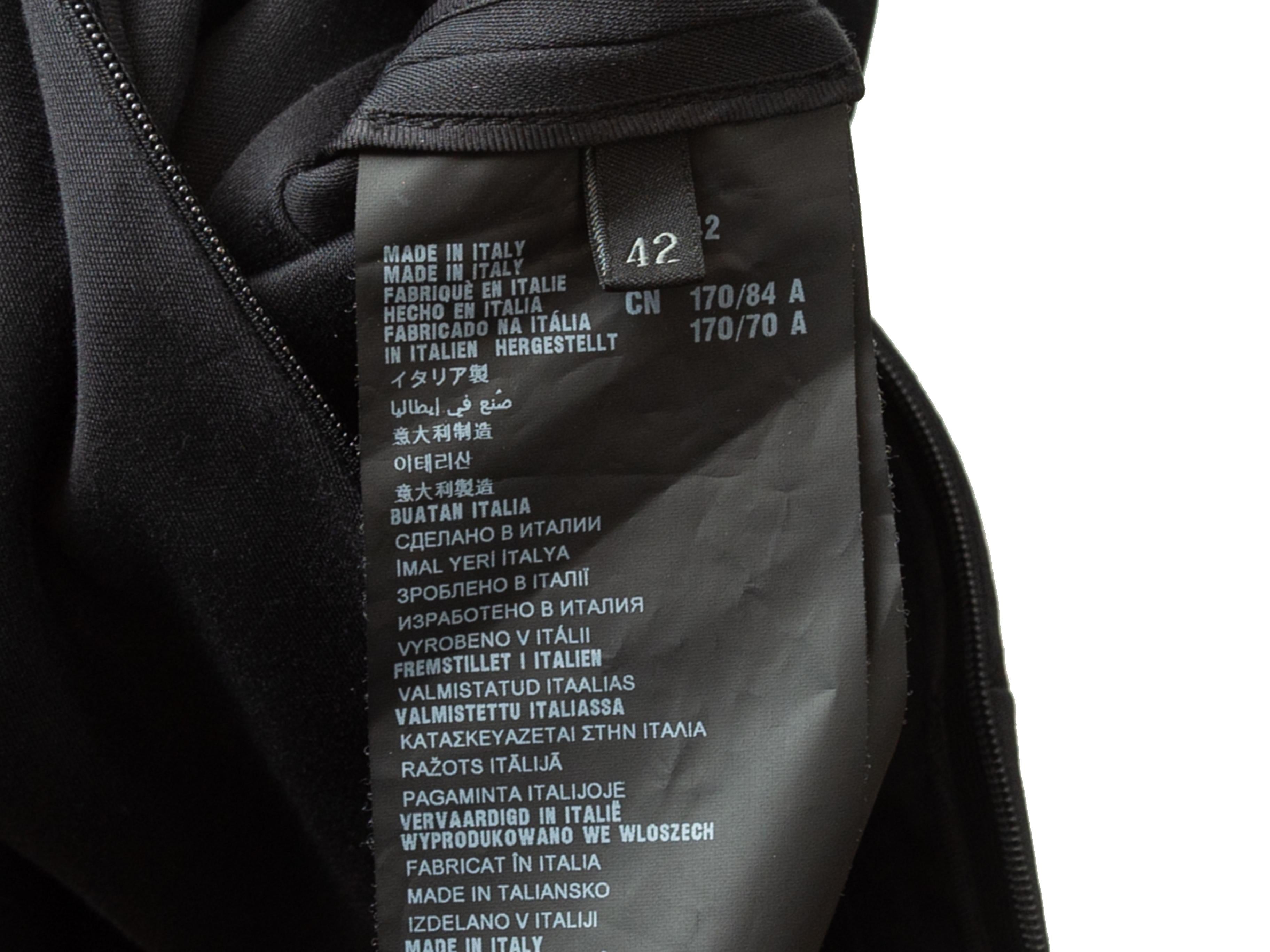 Product details: Black sleeveless fitted dress by Prada. Round neckline. Vent at back hem. Concealed zip closure at center back. Designer size 42. 42