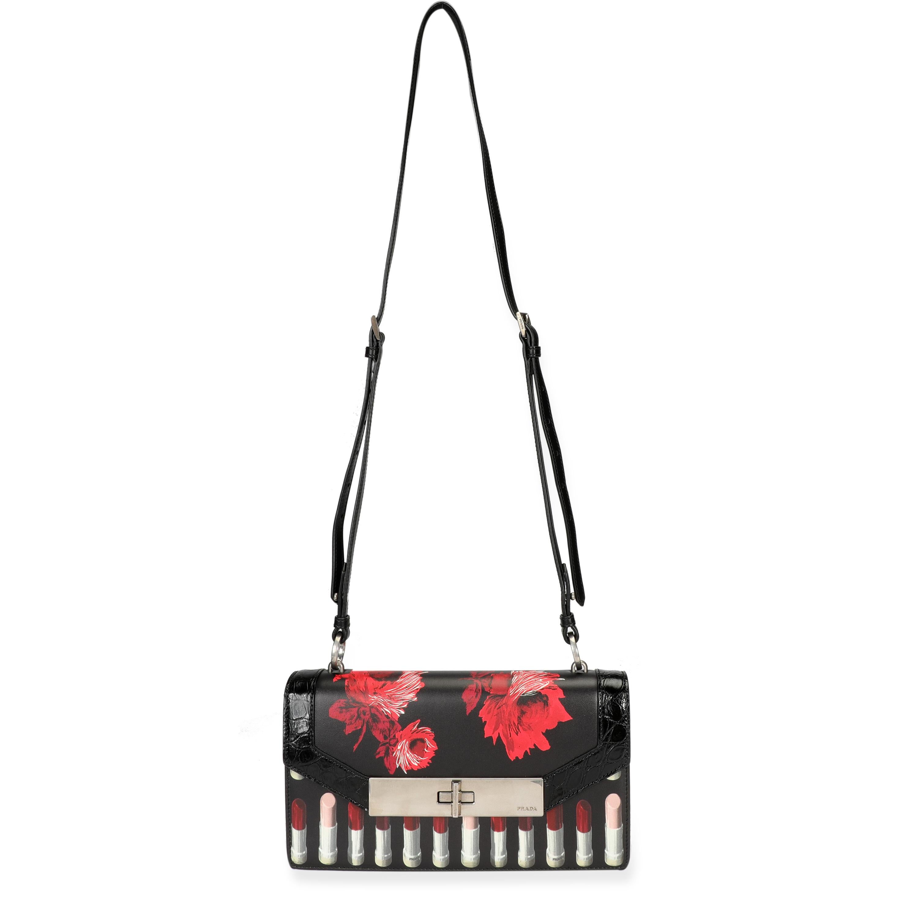 Prada Black Floral & Lipstick Print Leather Séverine Bag
SKU: 106960
MSRP: USD 3,600.00

Condition Description: The always cheeky Prada introduced the Séverine bag in 2018. This version features a floral and lipstick print with embossed