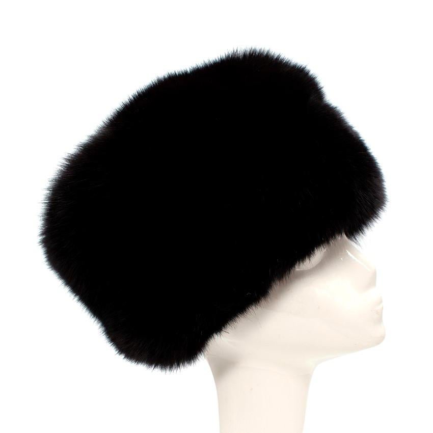 Prada Black Fox Fur Hat
 

 - Inky black dyed blue fox
 - Traditional style with flat crown
 - Lined with black satin for comfort
 - No brim
 

 Materials:
 Fox fur
 Nylon
 

 Made in Italy
 Dry clean only
 

 PLEASE NOTE, THESE ITEMS ARE PRE-OWNED