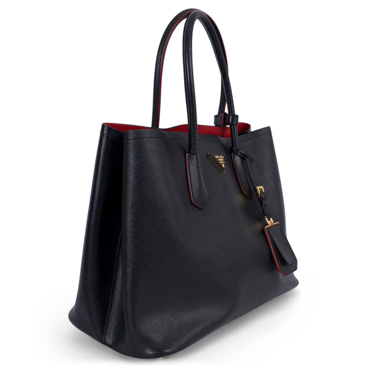 100% authentic Prada Large Double bag in Nero black Saffiano leather. Features double handles and a detachable shoulder strap, gold-tone hardware, a leather name tag with metal details, metal lettering logo on a leather triangle at the front and