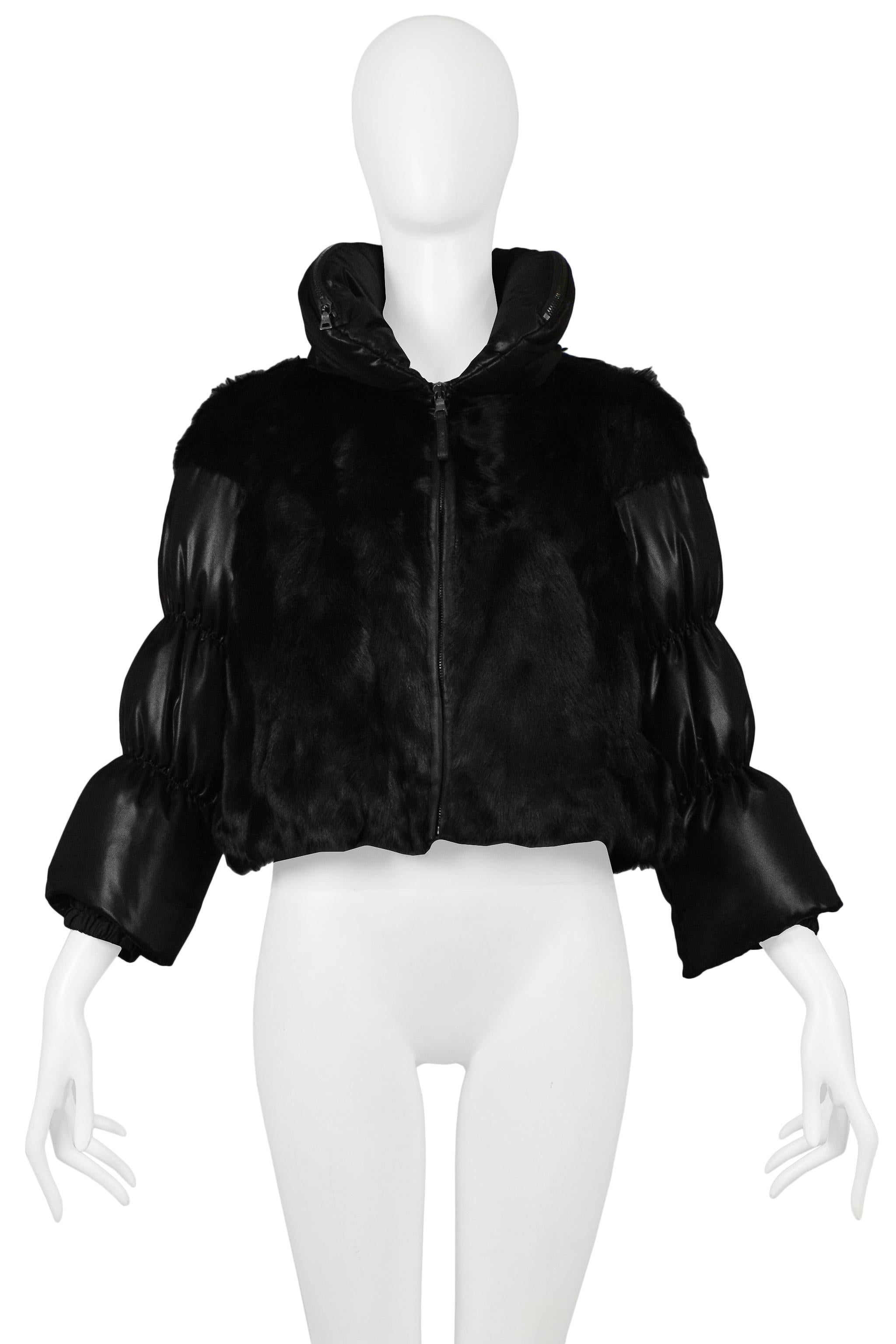Resurrection Vintage is excited to offer a vintage Prada dyed, black, goat fur cropped jacket featuring 3/4 length sleeves, a high collar with a hidden hood, side slit pockets, and a center front zipper. 

Prada, Italy
Size 42
Goat Fur, Acetate, and