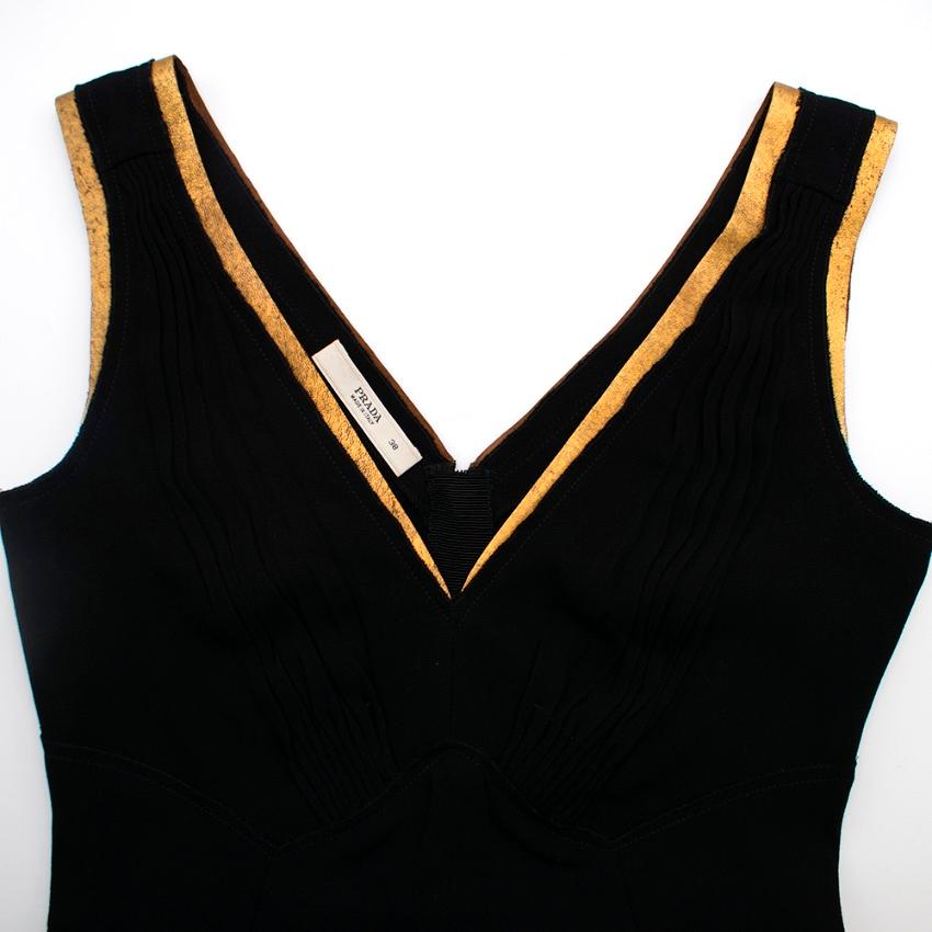 Prada Black Acetate & gold Leather Top 

- Back Velvet Bow/Belt Detail 
- Back Invisible Zip 
- Gathered Details 
- Leather Gold Contrast On Straps 
- V Shaped Neckline 

78% Acetate 
22% Polyethylene 

Dry Clean Only 

Made in Italy 

Please note,