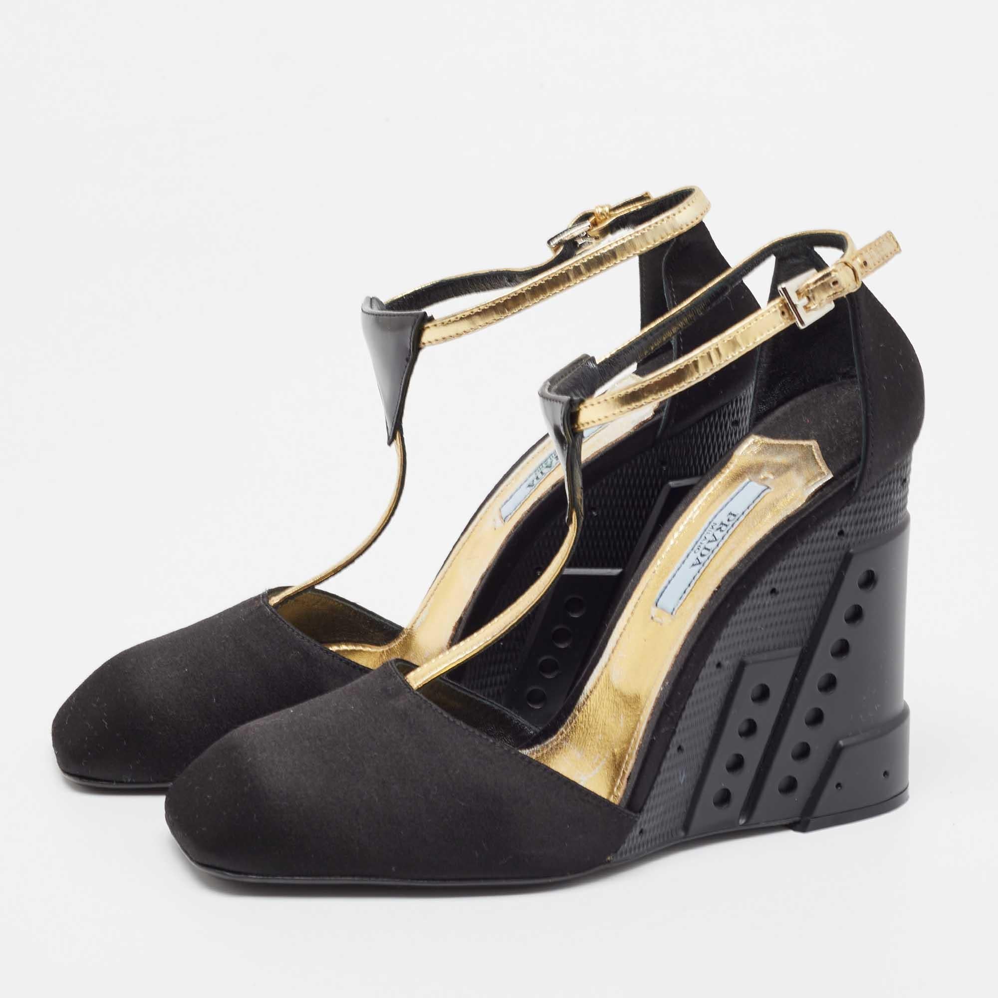 These Prada black wedge sandals will frame your feet in an elegant manner. Crafted from quality materials, they display a classy design and comfortable insoles.

