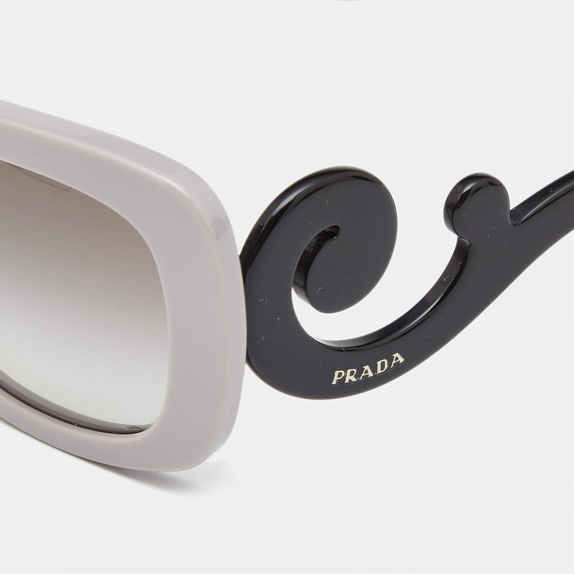 Get the glam quotient raising with these stunning Baroque sunglasses from the house of Prada. Designed in a black acetate frame  this pair features a square frame and fitted with grey gradient tinted lenses. The highlighting feature of this pair is
