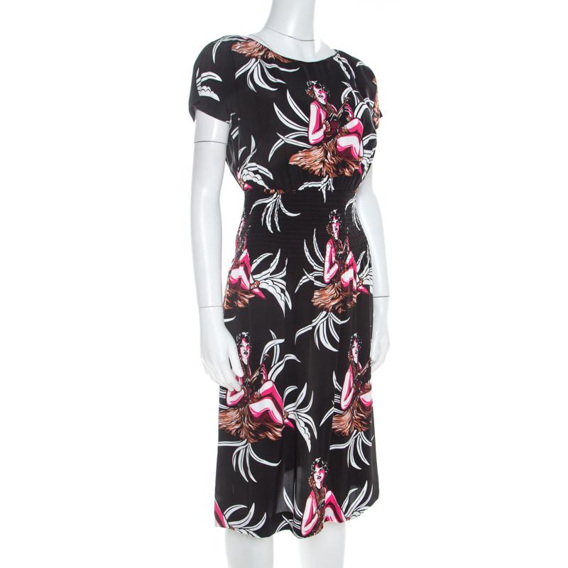 This Prada dress is lovely! It is well-tailored and designed with an elasticized waistline and gorgeous Hawaiian Girl prints on the front. You may style it with a pair of colourful sandals and a shoulder bag.

Includes: The Luxury Closet