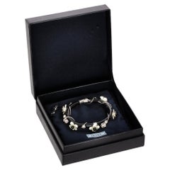 Prada - Bracelet noir et ivoire à motif de fleurs