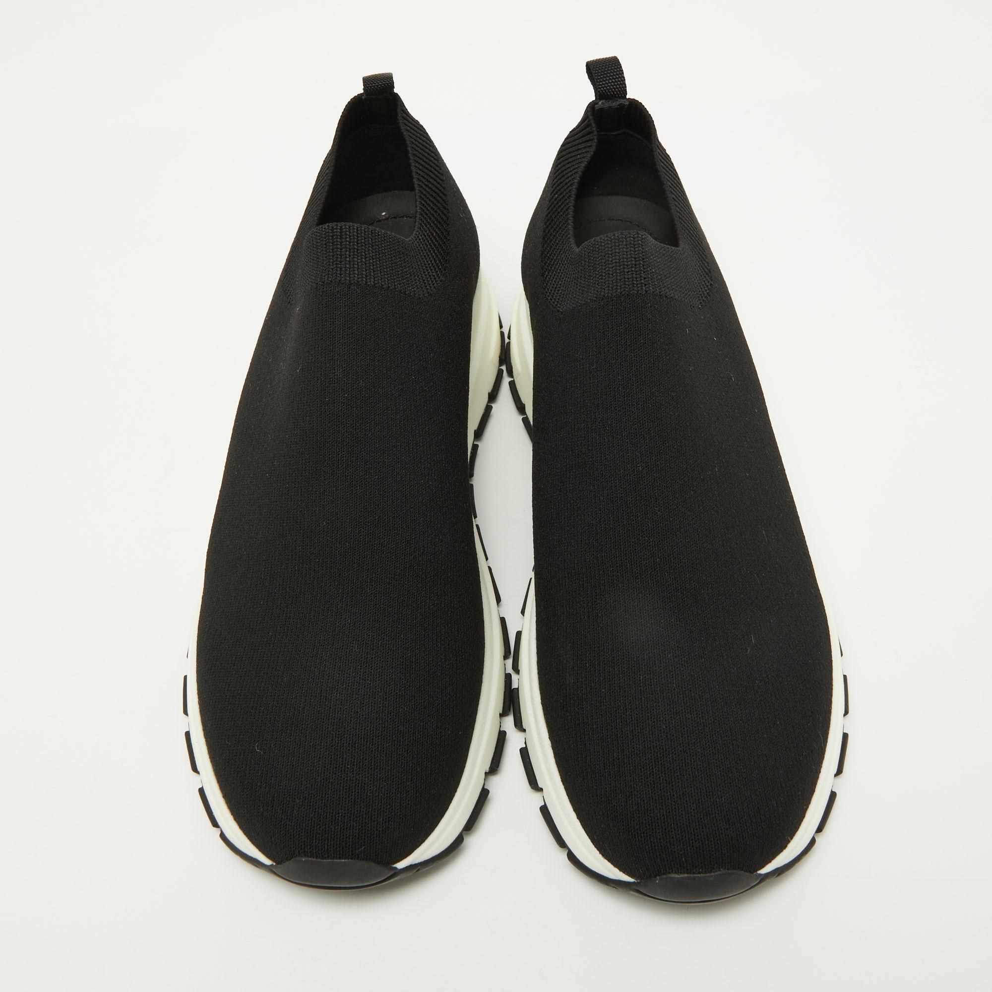 Coming in a classic silhouette, these Prada fabric sneakers are a seamless combination of luxury, comfort, and style. These sneakers are designed with signature details and comfortable insoles.

