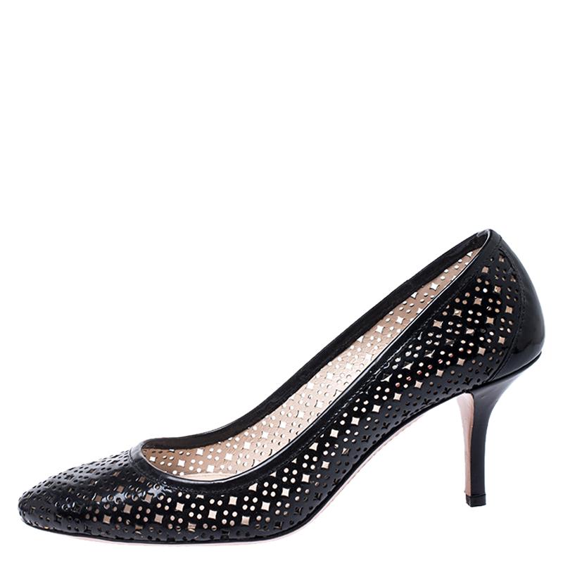 Crafted from laser cut patent leather, this pair of pumps will make you look like a diva. The epitome of comfort and class, this pair of pumps by Prada is ideal for both formal and casual outings. This pair of black pumps are complete with stiletto