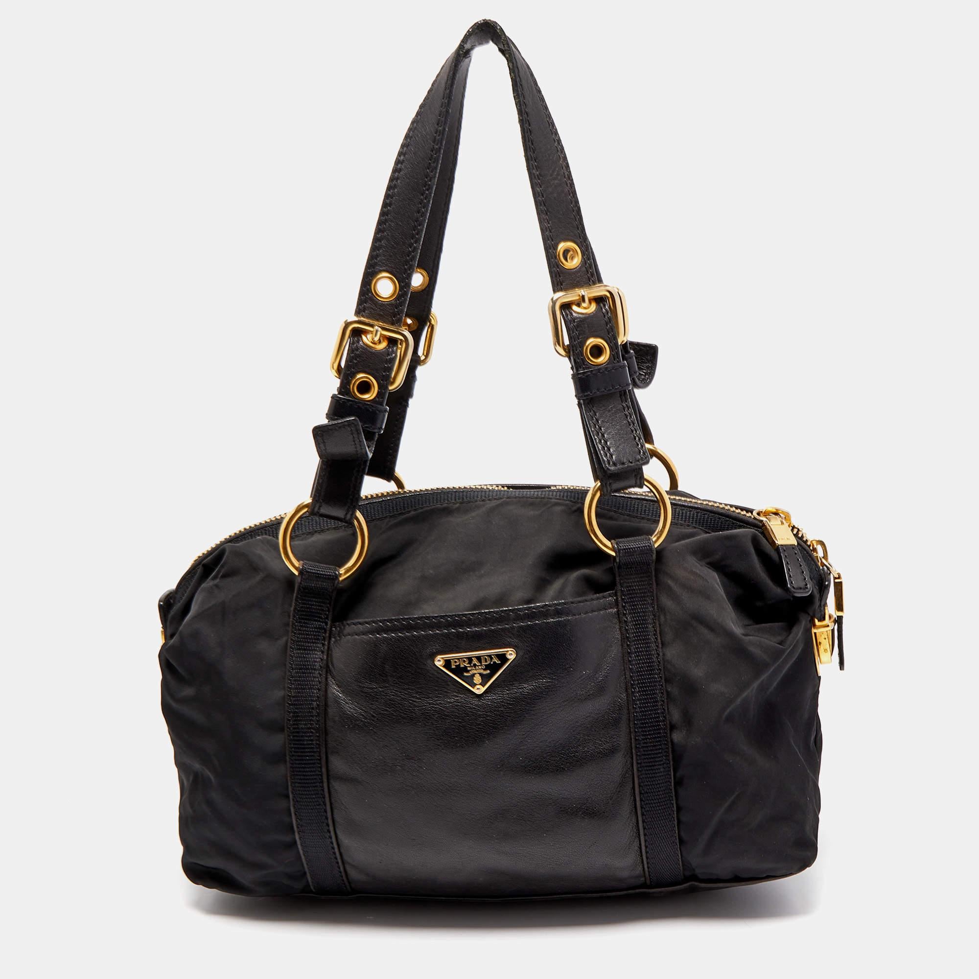 Elevate your style and have your essentials with you as you carry this authentic Prada bag. Crafted using leather & nylon, the bag has two handles, a pocket detail on the front, and a nylon-lined interior.

Includes: Info Booklet, Authenticity Card
