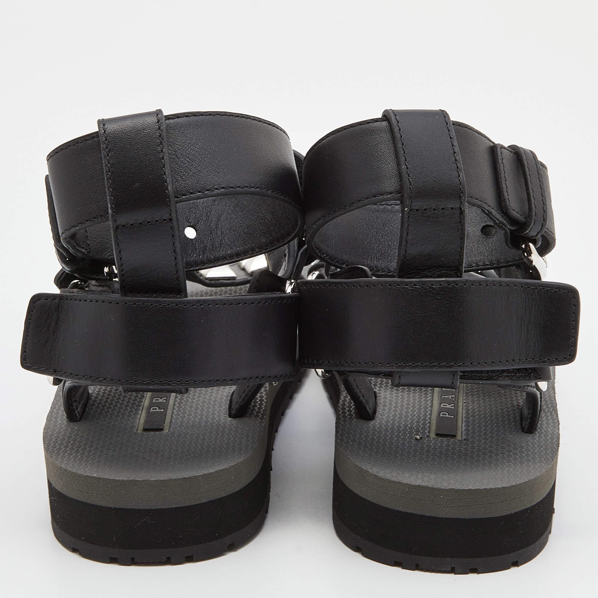 Prada Black Leather and Rubber Punk Stud Ankle Strap Flat Sandals Size 37.5 In New Condition In Dubai, Al Qouz 2