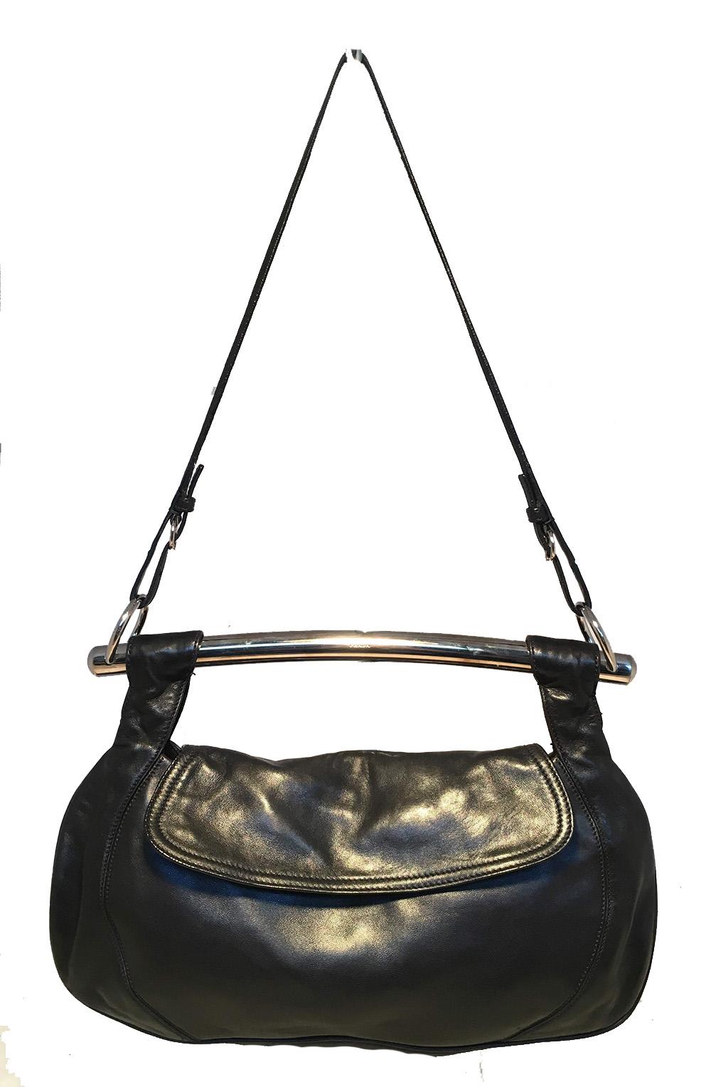 Prada Black Leather Bar Top Handle Convertible Handbag in very good condition. Soft black calfskin leather exterior trimmed with silver hardware and signature enamel logo plate on back side. Top Silver bar handle and attached thin black leather