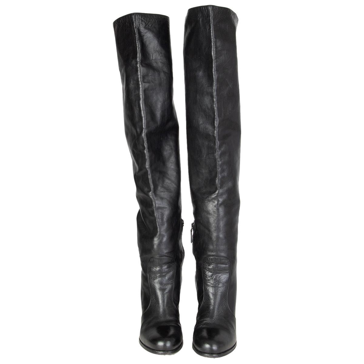 100% authentic Prada over-knee boots in smooth black calfskin featuring a chunky heel. Open with a zipper mid-claf zipper on the inside. Have been worn and are in excellent condition. 

Measurements
Imprinted Size	38
Shoe Size	38
Inside Sole	25cm