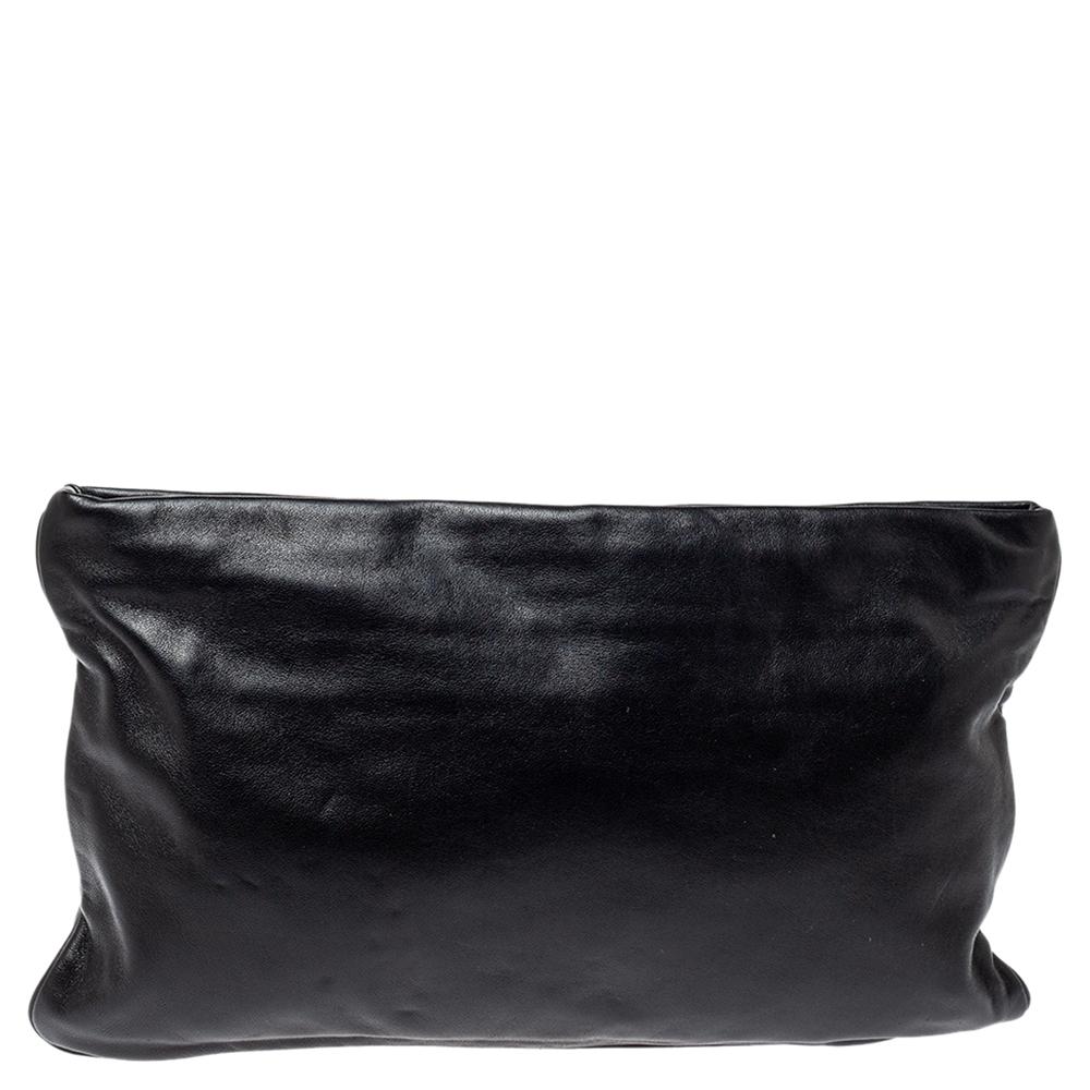 This bag by Prada has a rich and classy look that can be easily paired with any of your favorite outfits. Classiness pairs with style for this notable yet playful black-hued clutch. It has a car-applique in the front and a spacious leather-lined
