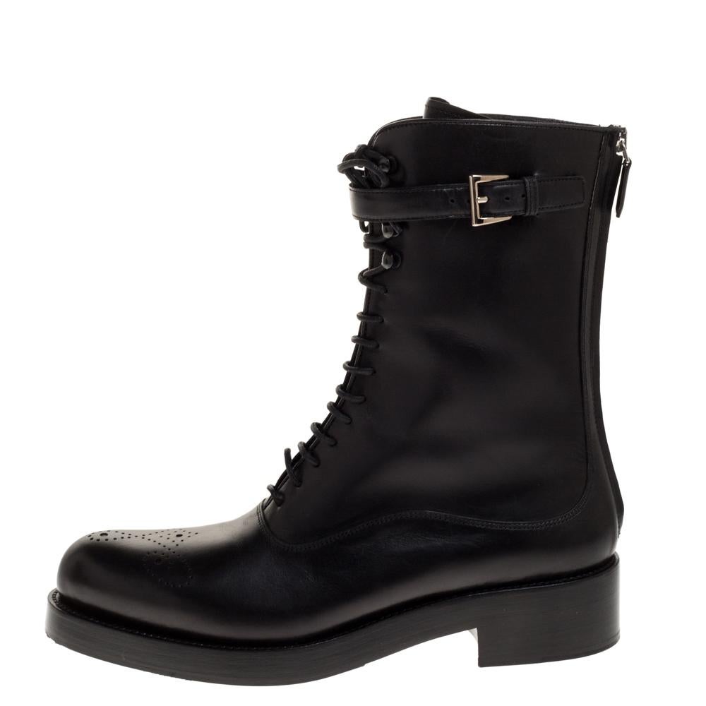 Combat boots are stylish, trendy, and will never go out of style. This pair by Prada has been meticulously crafted in Italy and made from quality leather. They carry a versatile black hue and are designed to deliver chic looks. They are styled with