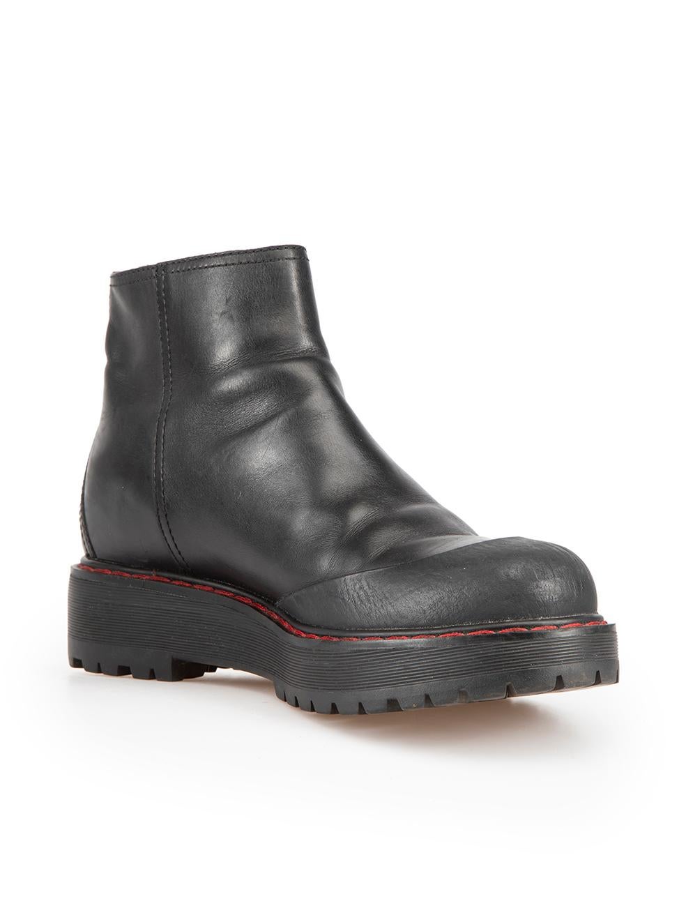 CONDITION is Very good. Minimal wear to boots is evident. Minimal wear to both boot toes, toe-caps and the left-side of the right boot with scratches and abrasions to the leather on this used Prada designer resale item.

Details
Black
Leather
Ankle