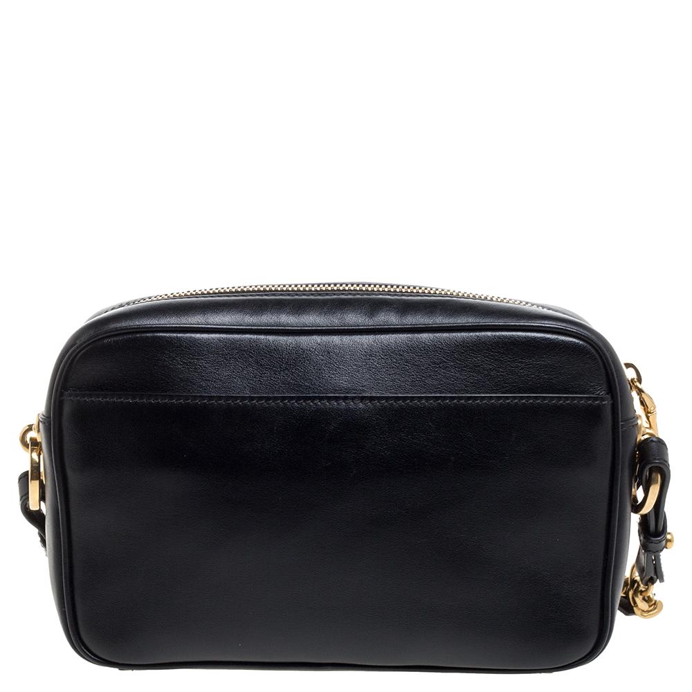 A beautiful and stunning piece from Prada, this crossbody bag will easily pair with your casual chic and glamorous looks with equal ease. Crafted in black leather, this bag is decorated with crystal embellishments all over the front. A