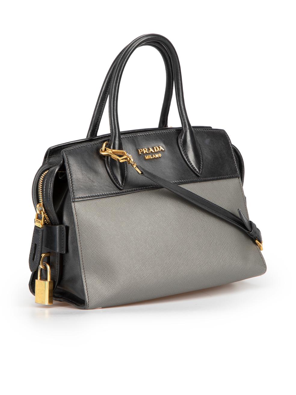 CONDITION is Good. Minor wear to handbag is evident. Light creasing leather and tarnishing to hardware with slight scuffing to outer corners on this used Prada designer resale item. Bag strap included.
  
  Details
  Esplanade
  Grey
  Leather
 