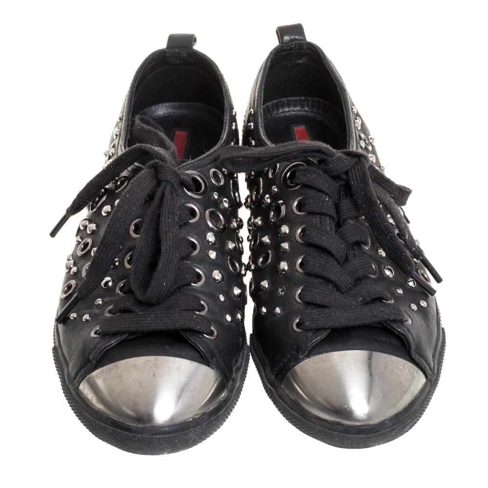 Team these trendy sneakers with your casuals for an effortless look. The house of Prada brings you these sneakers, decorated with grommets and equipped with rubber soles, to offer maximum comfort and style. Enhance your style with these black