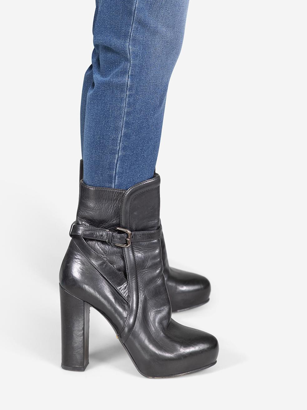 CONDITION is Very good. Minimal wear to the dress is evident. Abrasion to all leather areas of both shoes and both heels on this used Prada designer resale item.
 
 
 
 Details
 
 
 Black
 
 Leather
 
 Ankle boots
 
 Almond toe
 
 High block heel
 
