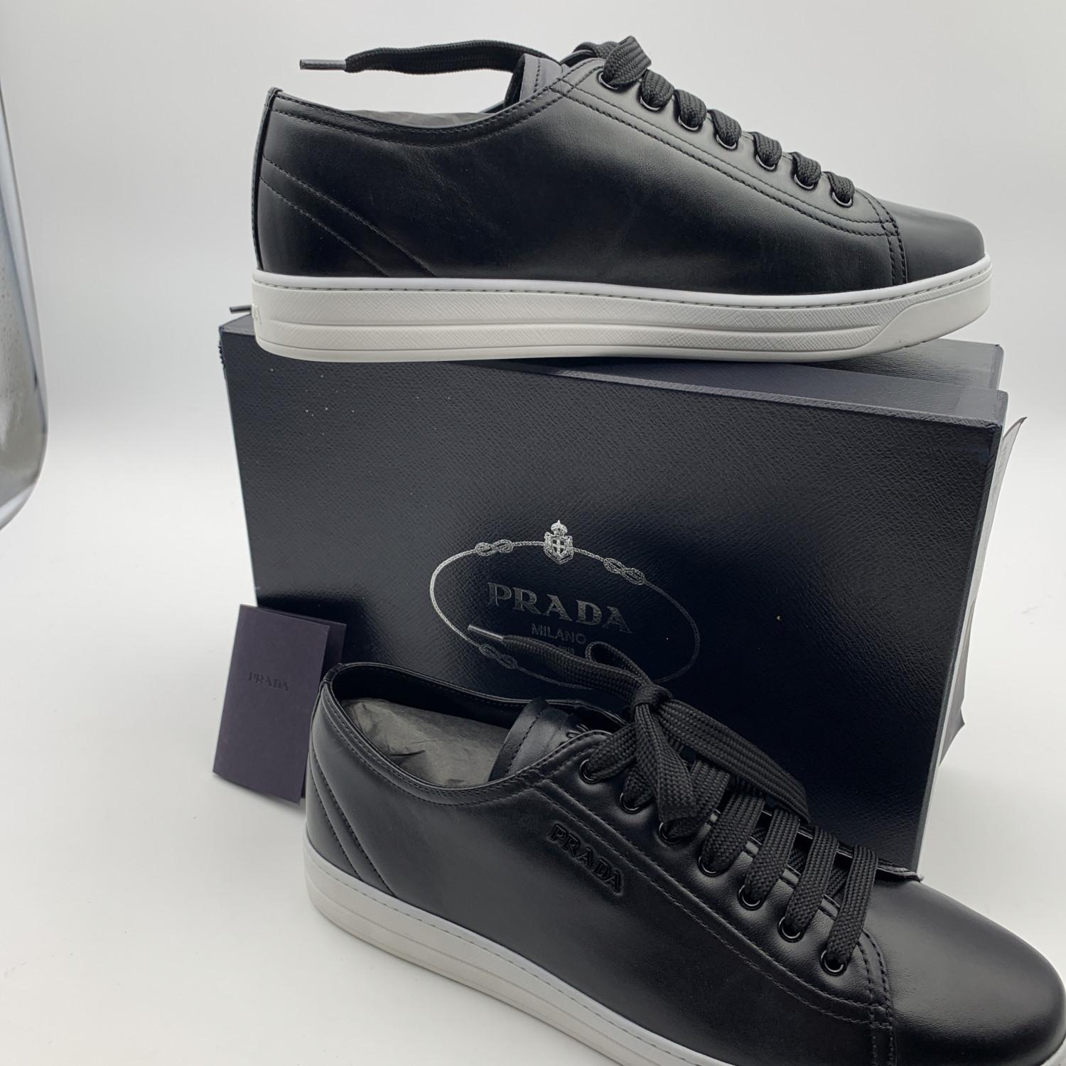 Beautiful Prada Sneakers, mod. 3E6187. Black leather. They feature a lace-up front, round toe and Prada logo lettering on the side. White rubber sole. Made in Italy. Size: 41 (The size shown for this item is the size indicated by the designer on the