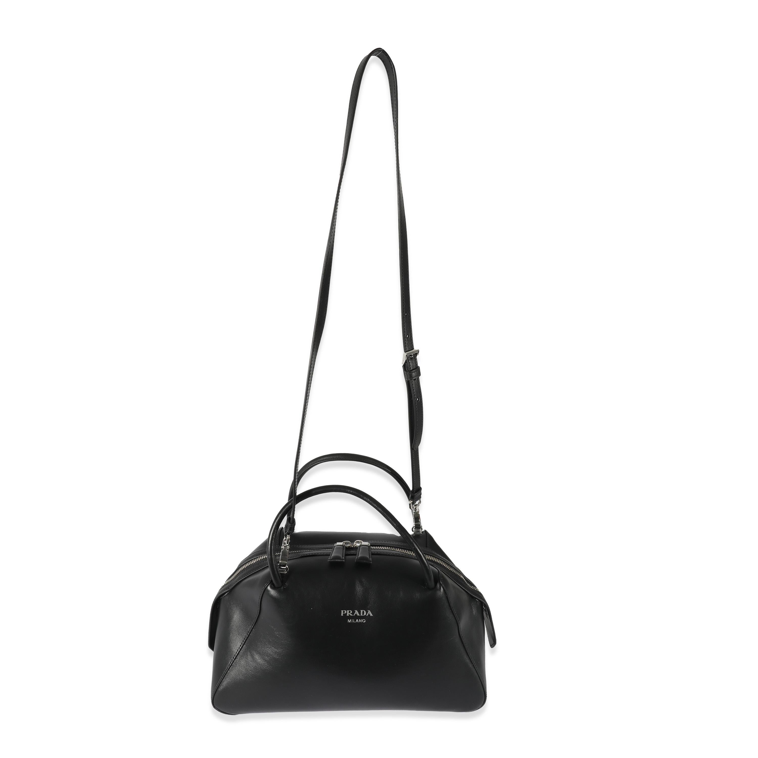 Listing Title: Prada Black Leather Medium Supernova Bag
 SKU: 128605
 MSRP: 4200.00
 Condition: Pre-owned 
 Handbag Condition: Excellent
 Condition Comments: Excellent Condition. Exterior and interior scuffing and faint marks.
 Brand: Prada
 Model: