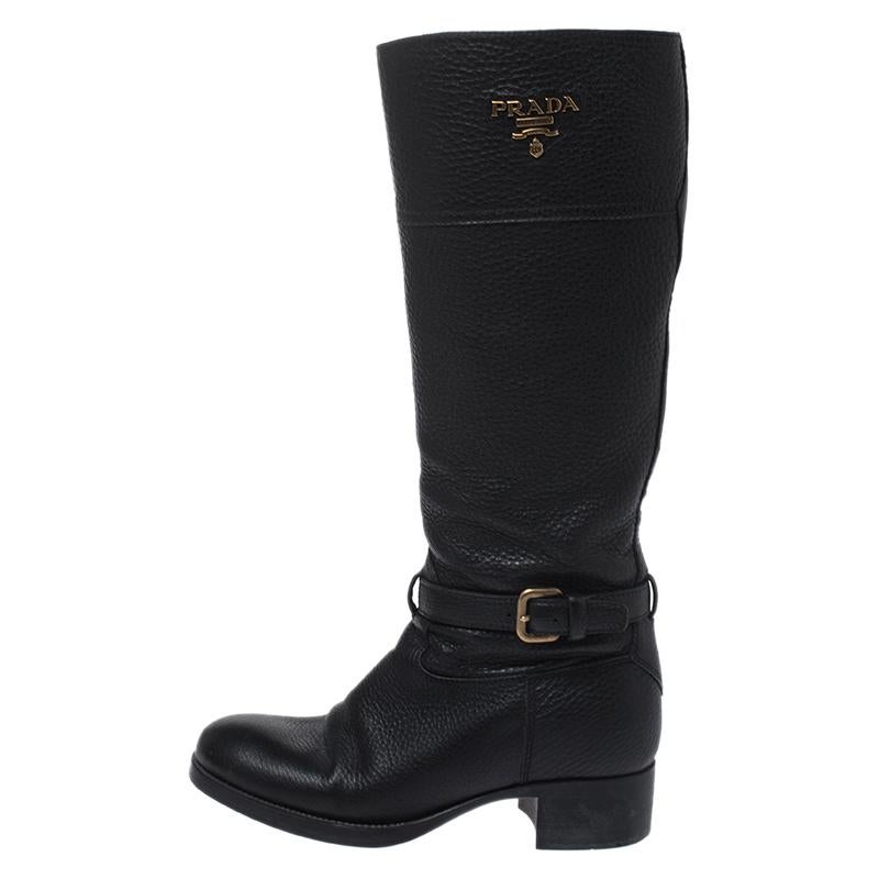 If you know your fashion well, these Prada boots are just what you need to make a style statement. Crafted from leather, the boots arrive in black. They feature round toes, tough soles and buckle details. They reflect excellent taste.

Includes: