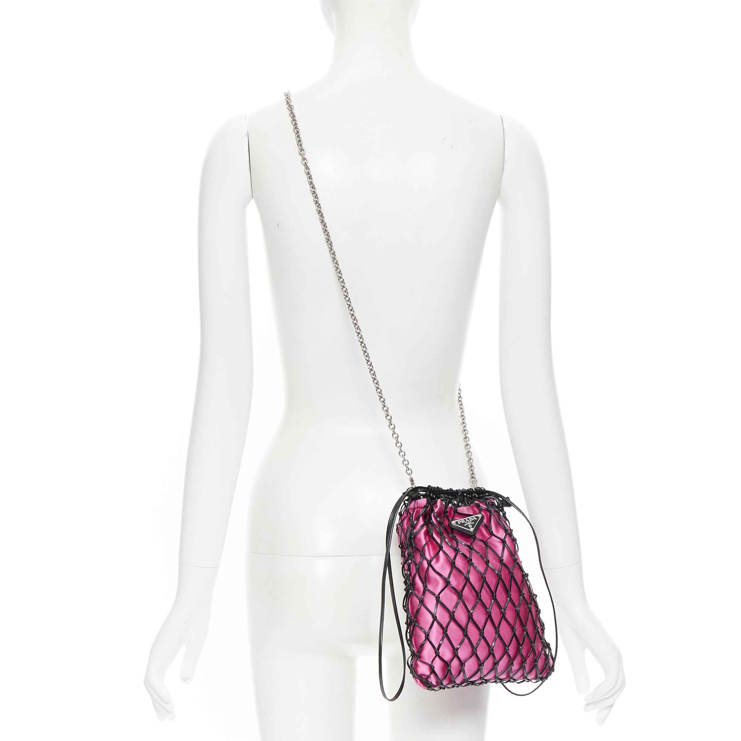 PRADA black leather net woven pink satin triangle logo drawstring crossbody bag Reference: TGAS/B00814 
Brand: Prada 
Designer: Miuccia Prada 
Model: Leather net bag 
Material: Leather 
Color: Black 
Pattern: Solid 
Closure: Drawstring 
Extra