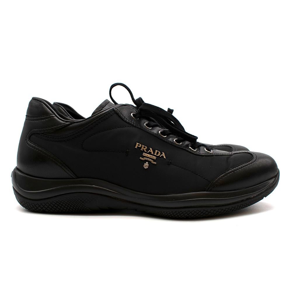 Prada Black Leather Nylon Low-Top Sneakers

- Calf leather with nylon technical fabric upper
- Prada metal logo on the side
- Prada signature logo tag on tongue
- Low-top style 
- Lace-up closure 
- Rubber outsole with Prada signature heat embossed